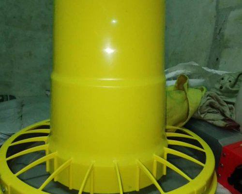 yellow compactor feeder